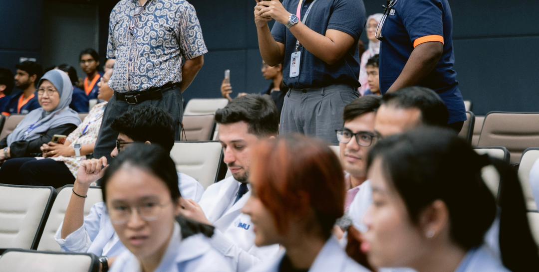 Healthcare professionals and guests at a medical seminar and learning event